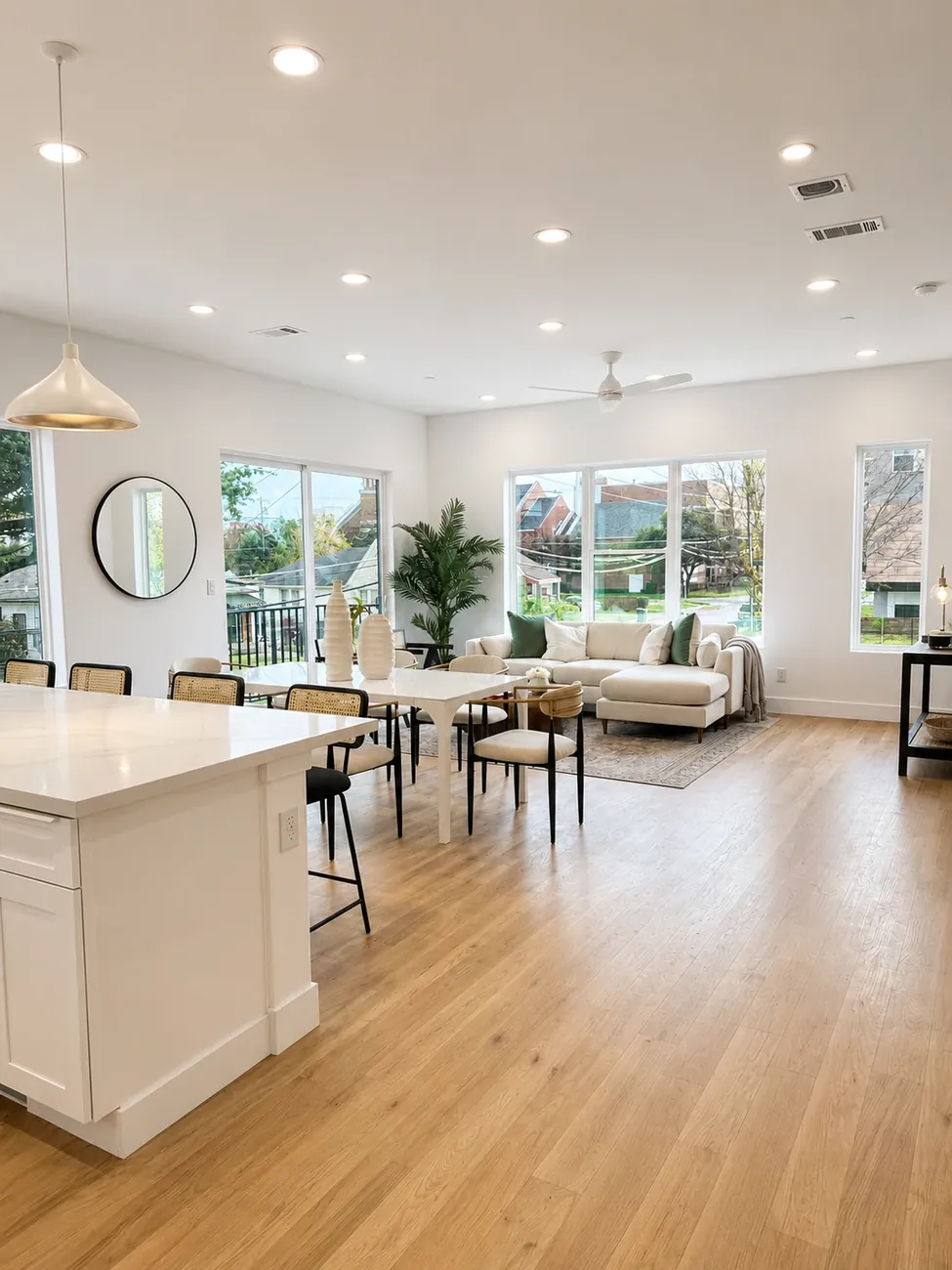 Open kitchen island and living room with oak floors